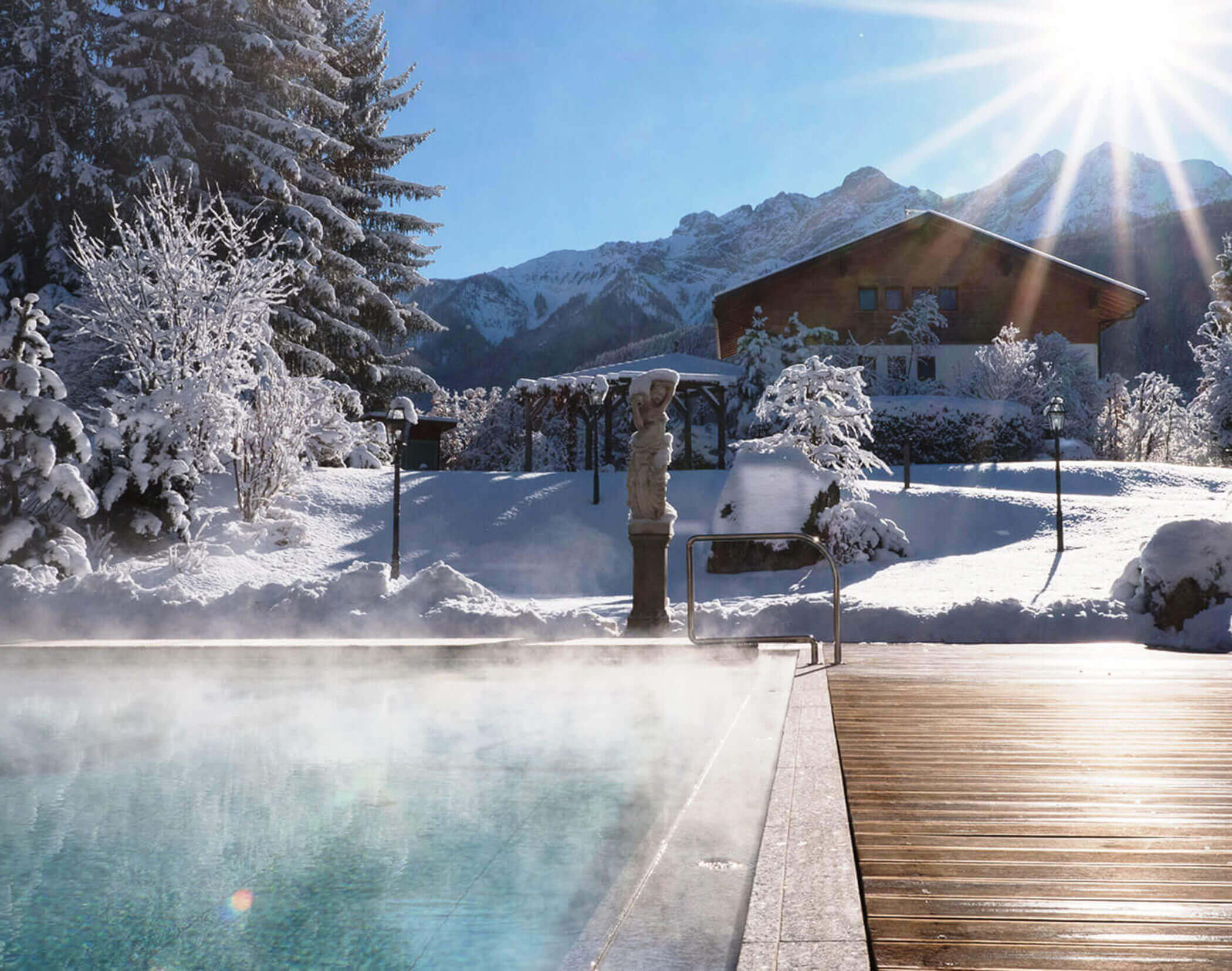 Outdoor pool in winter - Hotel Mirabell Dolomites 5 star in Valdaora